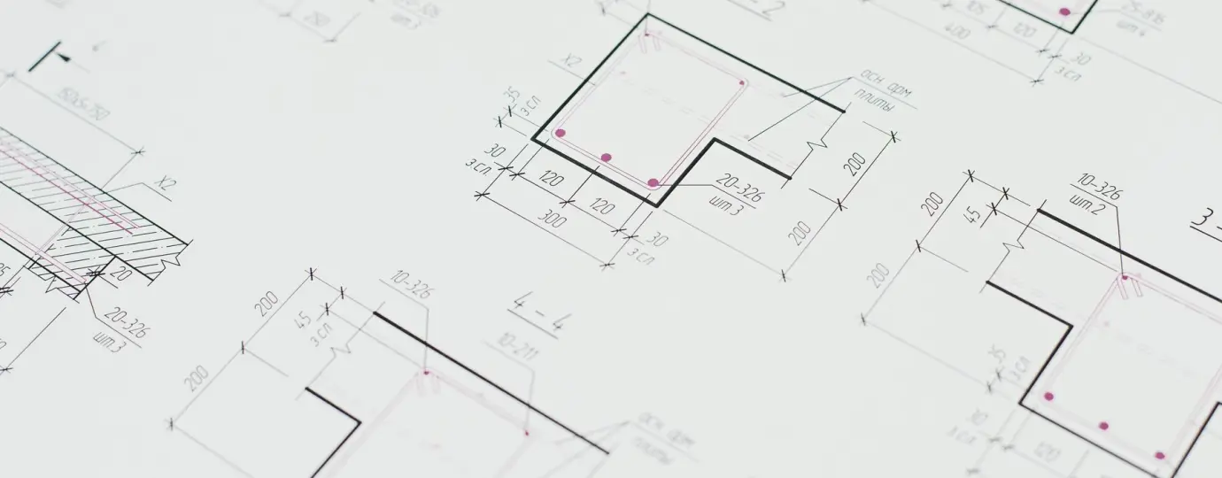 Engineer and producer reviewing a studio layout at the gallery desk